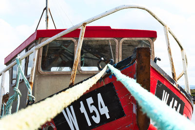 Close-up of old ship against sky