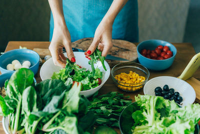 Midsection of woman eating food