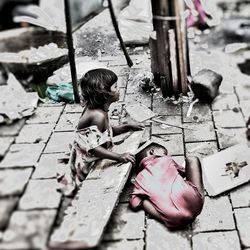 High angle view of children sitting on floor