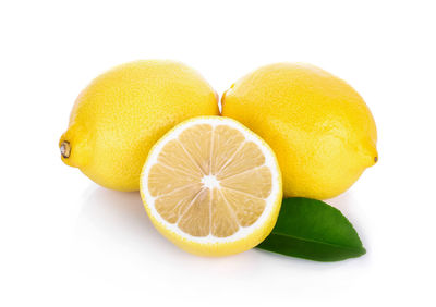 Close-up of lemons against white background