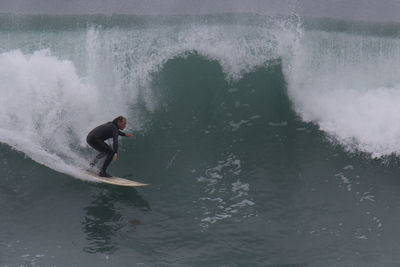 Man surfing in sea