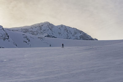 Scenic view of snowcapped mountain against sky