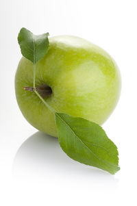 Close-up of fruit against white background