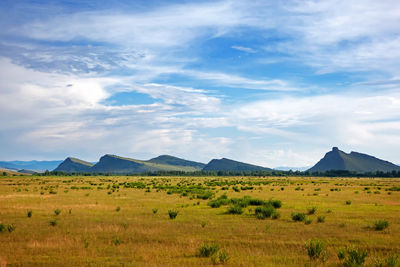 View of the mountain range sunduki, khakassia, russia. sky with clouds over mountains in the steppe