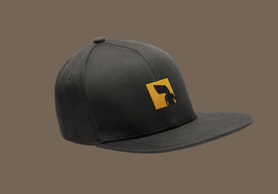 Close-up of hat against black background