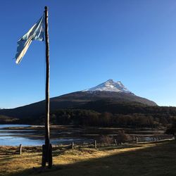 Scenic view of mountains against blue sky