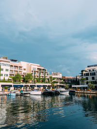 Boats in river against sky