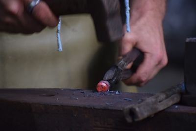 Close-up of man working on cutting board