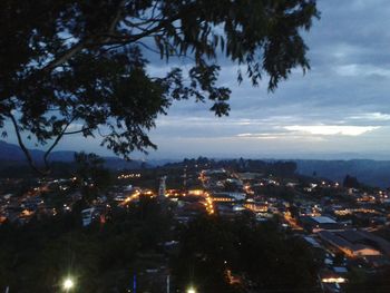 Cityscape against cloudy sky