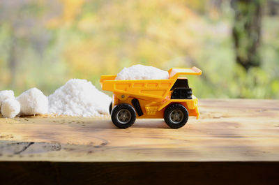 Toy truck with salt on table