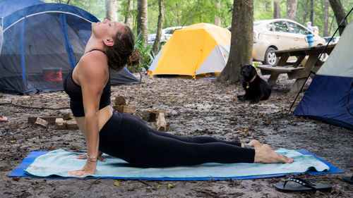 High angle view of people relaxing on tent