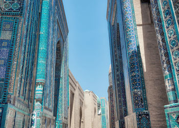 Low angle view of buildings against blue sky