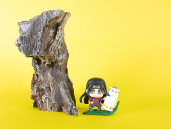 Close-up of chocolate on table against yellow background