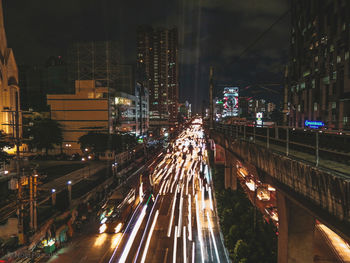 High angle view of light trails on city street at night