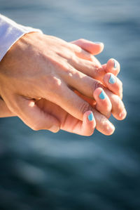 Close-up of woman hand holding water