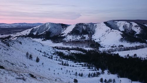 Scenic view of mountains against sky during winter
