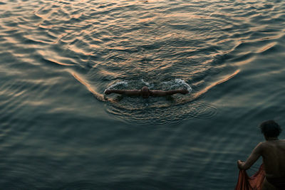Close-up of man swimming in lake