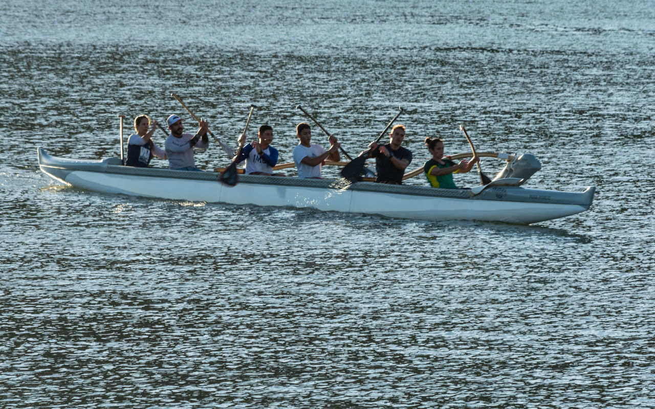 PEOPLE IN BOAT AT SEA SHORE