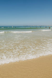 Scenic view of beach against clear sky