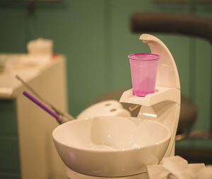 Close-up of pink juice on table