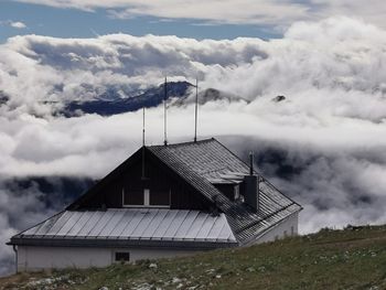 House on field against sky