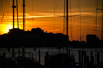 Silhouette of marina at sunset