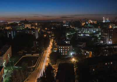 High angle view of illuminated city buildings at night