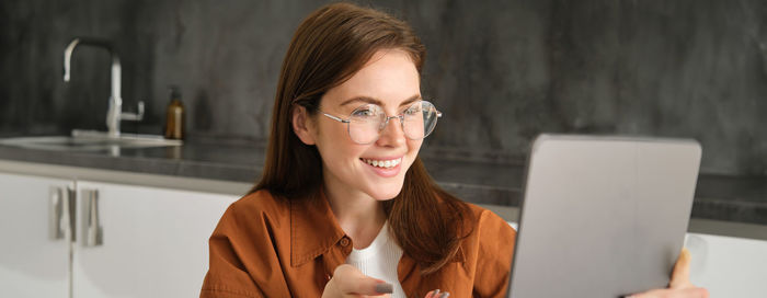 Young woman using laptop at home