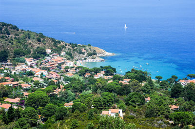 High angle view of sailboats by sea