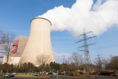 Low angle view of smoke stack against sky