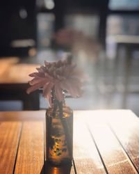 Close-up of flower vase on table