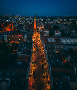 High angle view of illuminated buildings in city at night
