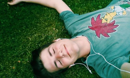 Portrait of cute girl lying on grass