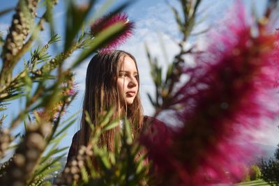 Portrait of woman with plants