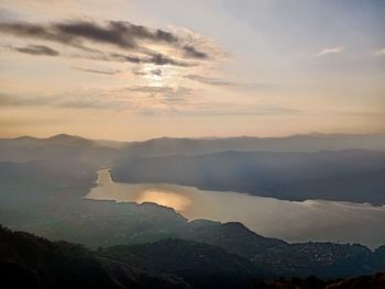 Scenic view of mountains against sky during sunset