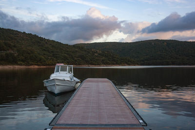 Boat in lake against sky