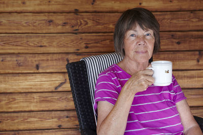 Senior woman having drink