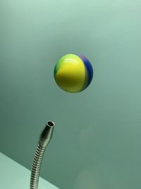 High angle view of balloons flying against blue background