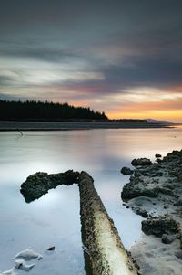 Scenic view of lake against sky during sunset