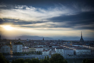 Cityscape against sky during sunset