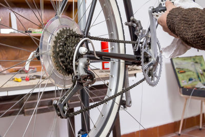 Man working on bicycle wheel