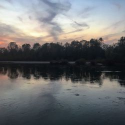 Scenic view of lake against sky during sunset