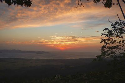 Scenic view of dramatic sky over landscape