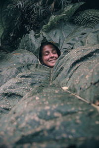 Portrait of smiling girl on tree