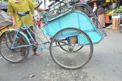 Low section of man cycling on bicycle