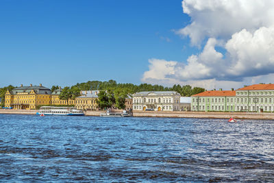 View of university embankment with menshikov palace from neva river, saint petersburg, russia