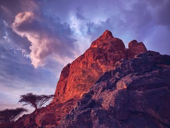 Low angle view of rock formation against sky