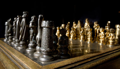 Close-up of chess pieces on table