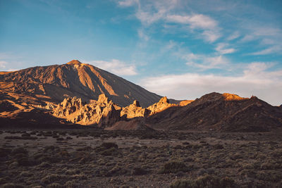 Scenic view of arid landscape against sky