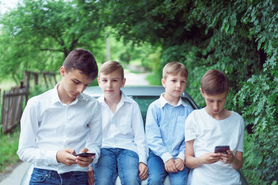 Friends using mobile phone